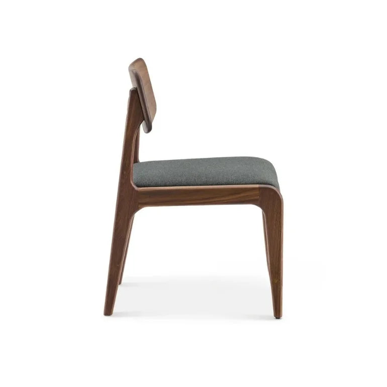 Side view of Aurelia Wooden Dining Chair with gently tapered legs and smooth sculpted structure