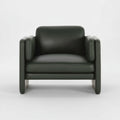 Straight-on image of Aveline Armchair emphasizing modern curved shape and inviting aesthetic