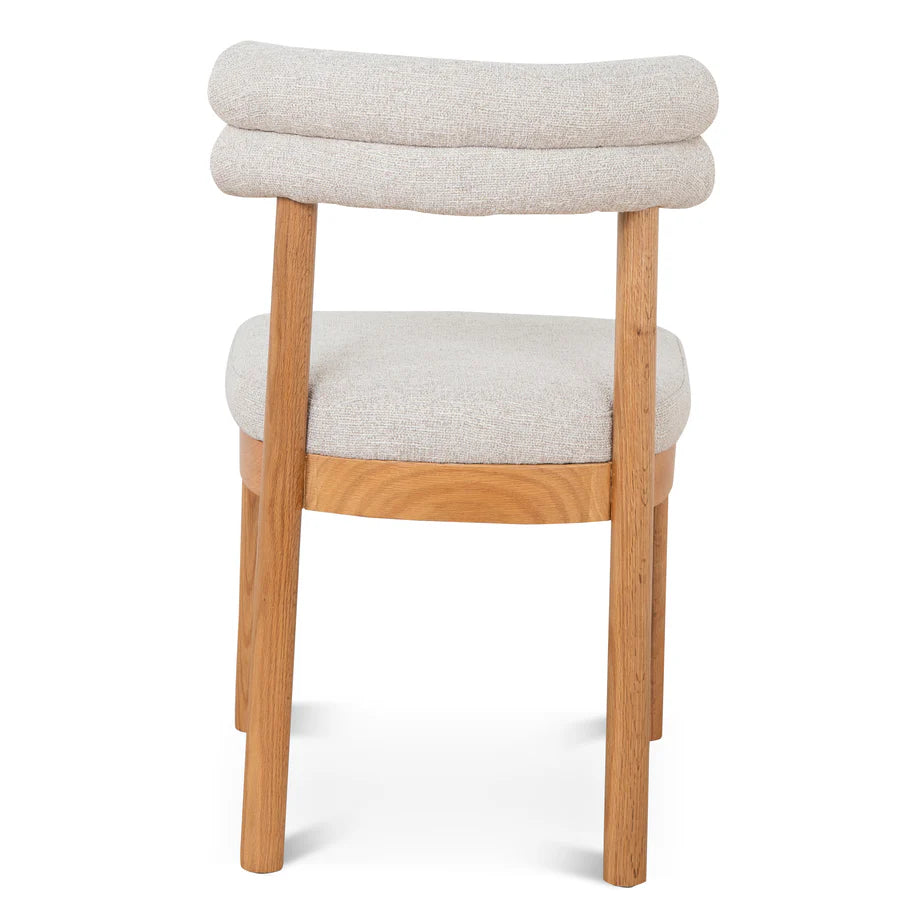 Detailed close-up of Coper Dining Chair’s fabric texture and clean seam craftsmanship and finishing. 