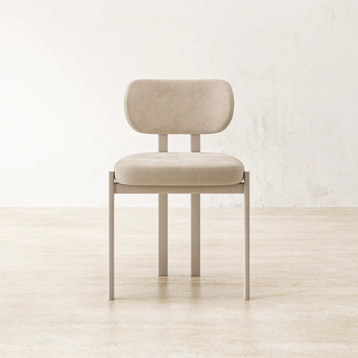 Coral Dining Chair featuring slim white legs and cushioned upholstered seat
