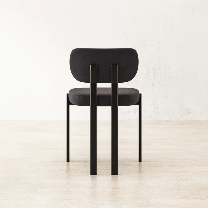 Back view of Black Coral Dining Chair revealing rounded seat cushion and supportive backrest