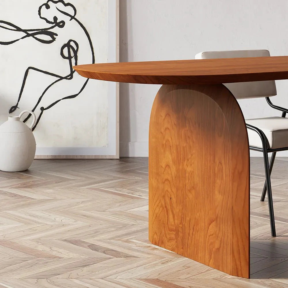 Detailed close-up of Deer Dining Table’s rich wood texture and precise base craftsmanship