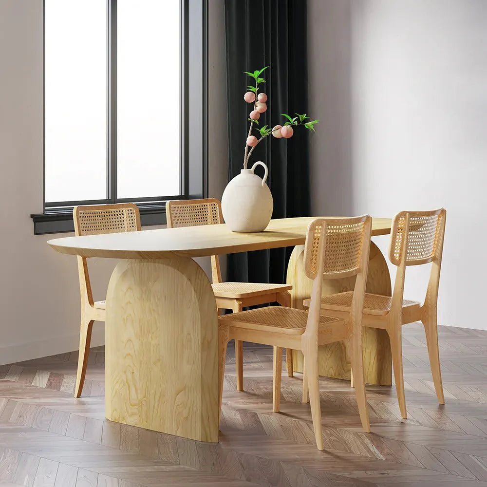 Deer Oval Dining Table in a contemporary UAE dining room with natural wood top and sculpted double-pillar base