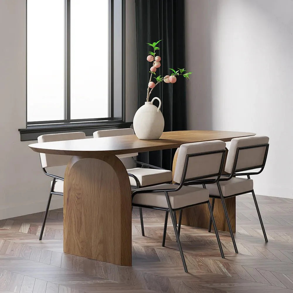 Deer Oval Dining Table in a contemporary UAE dining room with natural cherry wood color top and sculpted double-pillar base