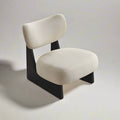Angled view of Eden Accent Chair highlighting sculpted backrest, cushioned seat, and slim legs