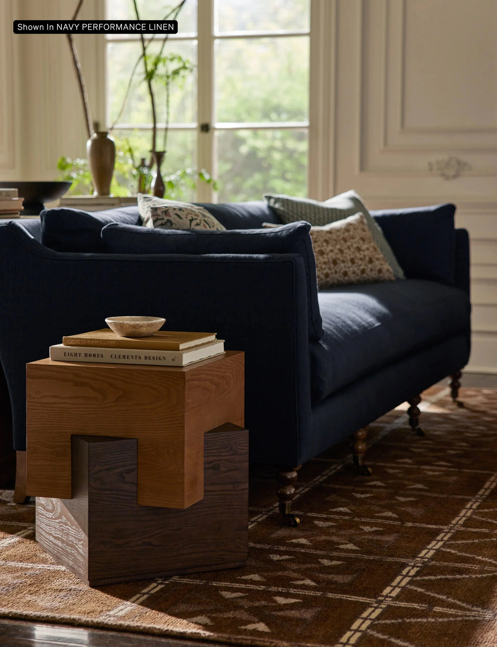 Hwan Sofa styled with a soft-toned rug and side table in a modern UAE apartment interior