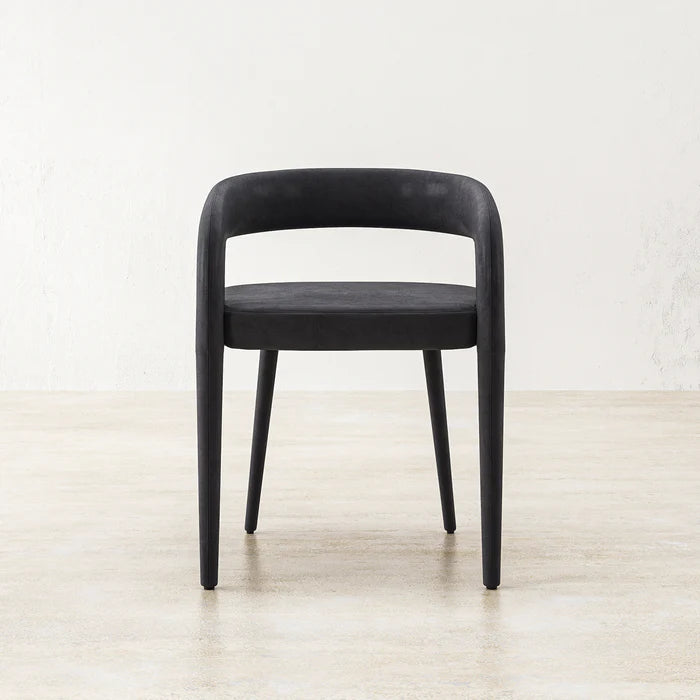 Straight-on image of black Charcoal Gladiator Dining Chair emphasizing modern silhouette and bold structure