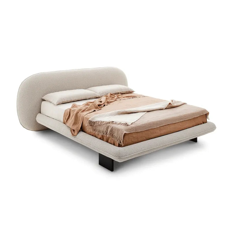 Grimlock Upholstered Bed styled with cozy bedding and soft decor