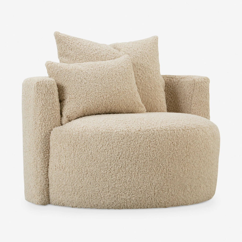 Angled view of Jong Lounge Chair highlighting curved arms, upholstered seat