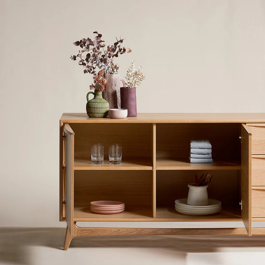 Detailed close-up of Klaus TV Console’s rich wood texture and smooth handle-free cabinet doors and internal shelving storage