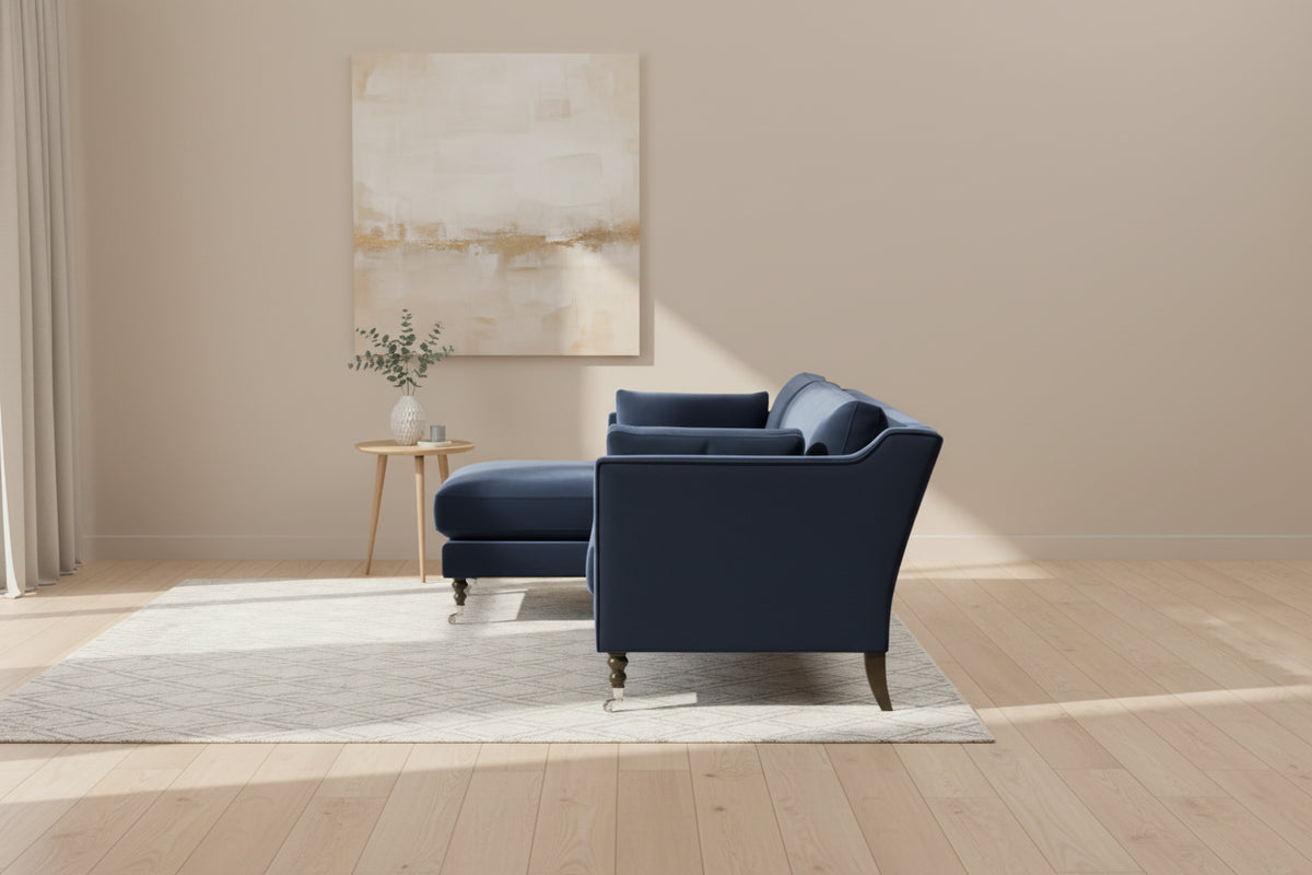 Side angled view of Lennart Sofa in rich blue velvet.