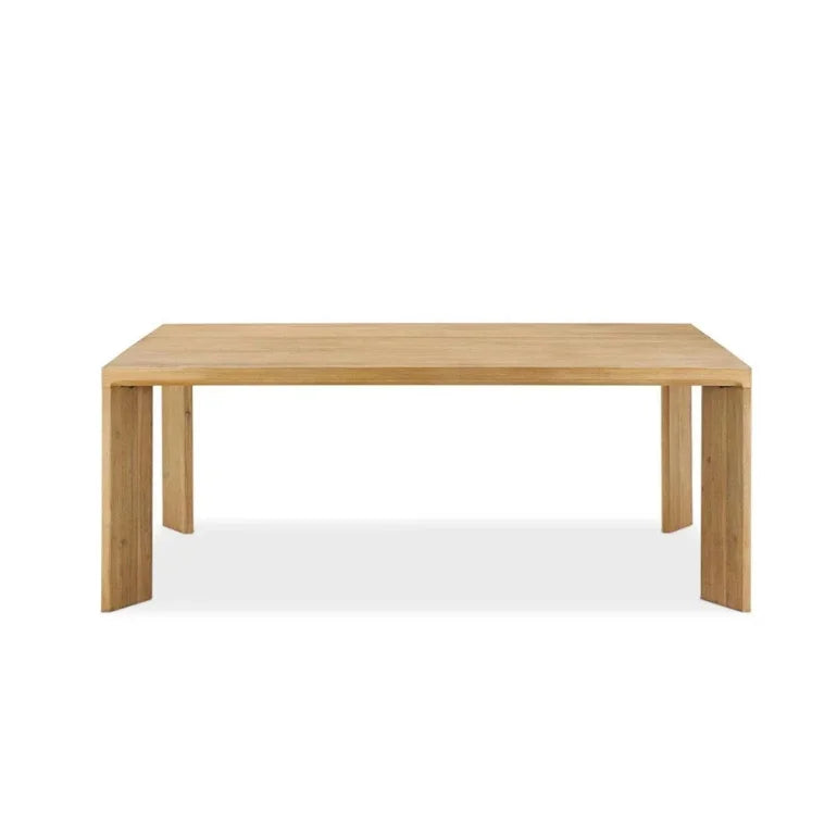 Straight-on image of Lunaro Dining Table emphasizing sculptural base and timeless wooden elegance