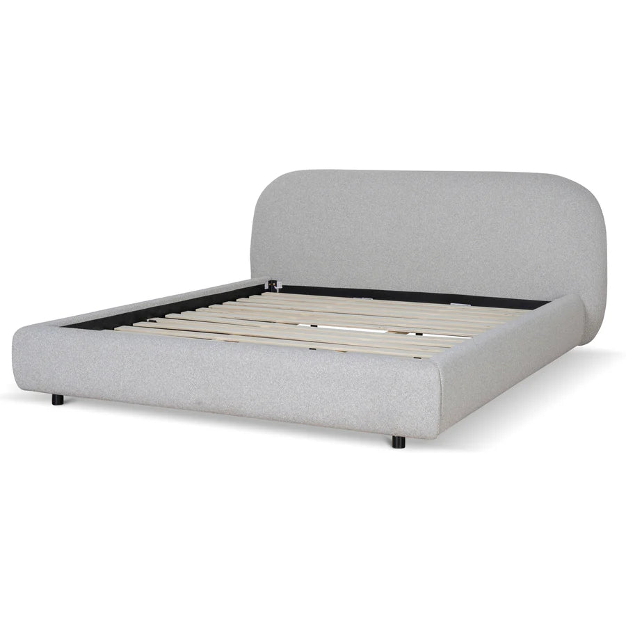 Side view of Merida Upholstered Bed with rounded edges, upholstered rails,