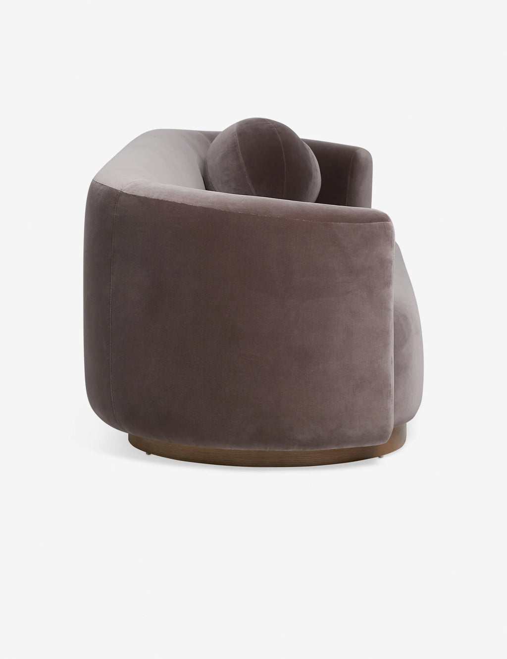 Angled view of the Mills Sofa showing curved backrest