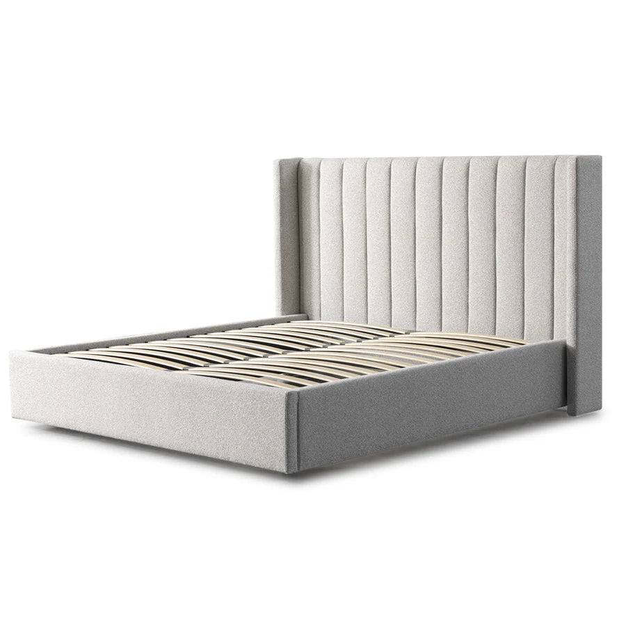 Angled view of Mortimer Bed showcasing its dual-cushion headboard and clean-lined modern frame