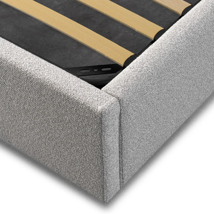 Detailed close-up of Mortimer Bed’s clay grey polyester upholstery and soft foam-cushioned