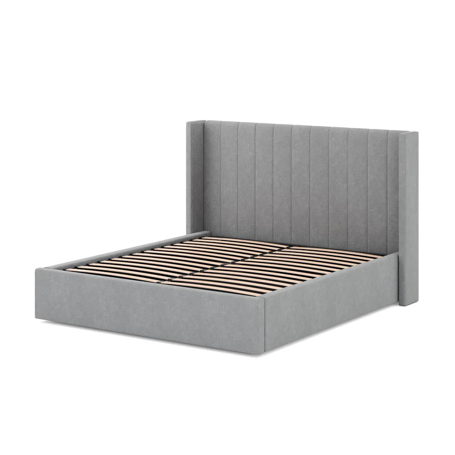 Angled view of Mortimer Bed showcasing its dual-cushion headboard and clean-lined modern frame