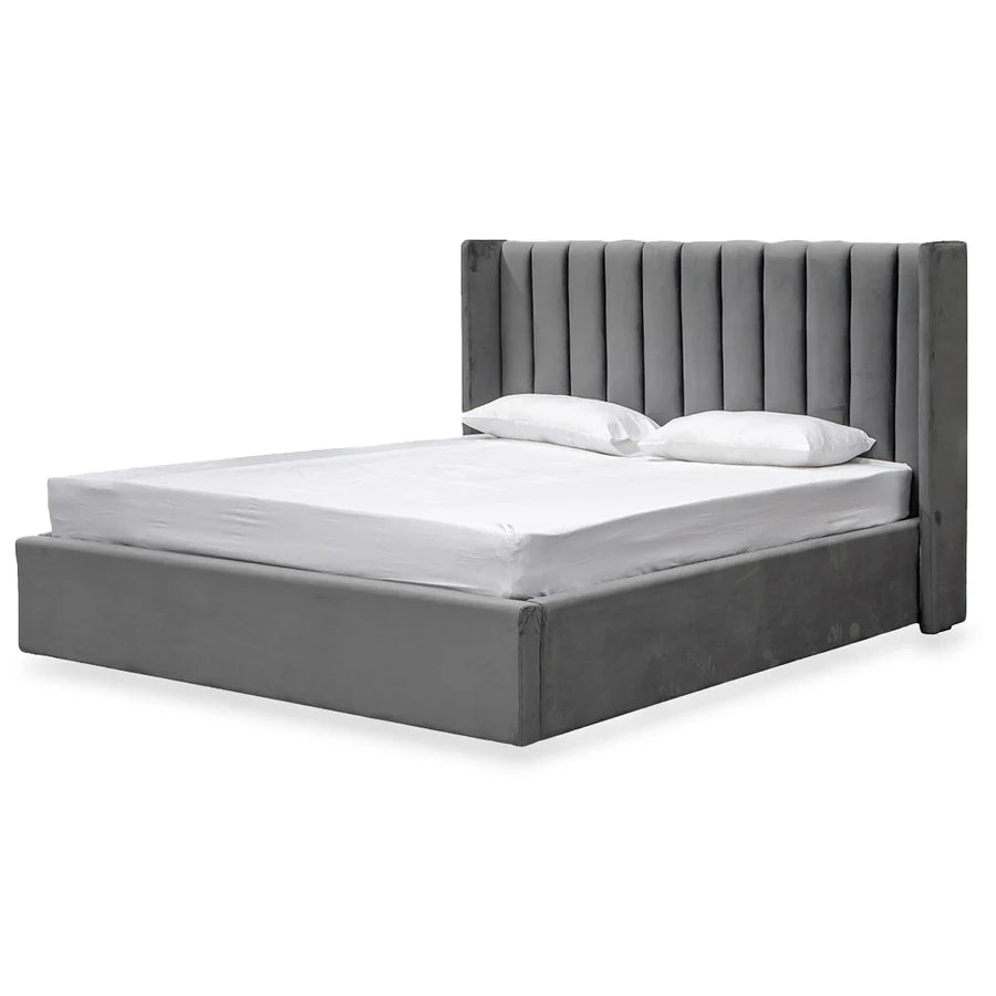 Mortimer Upholstered Bed styled with minimalist bedding in a soft-lit