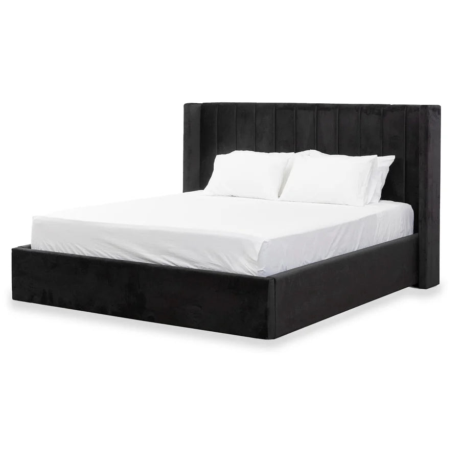 Mortimer Upholstered Bed in a contemporary UAE bedroom, featuring black fabric and wide platform base