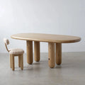 Nacht solid wood dining table with rounded capsule top and chunky legs