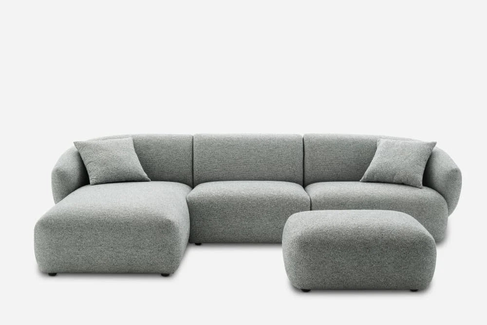 Straight-on image of Novaro Modular Sofa emphasizing symmetrical proportions and plush padded comfort in gray fabric.
