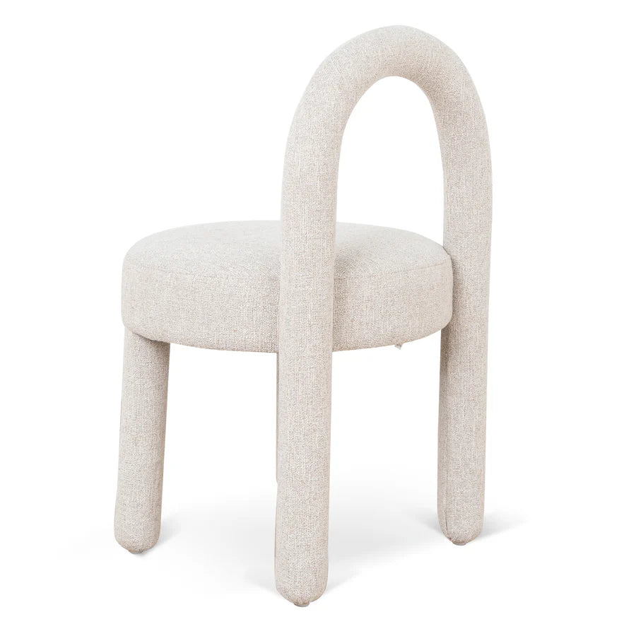 Back view of Rylon Dining Chair highlighting soft cushioned backrest and contemporary curved frame