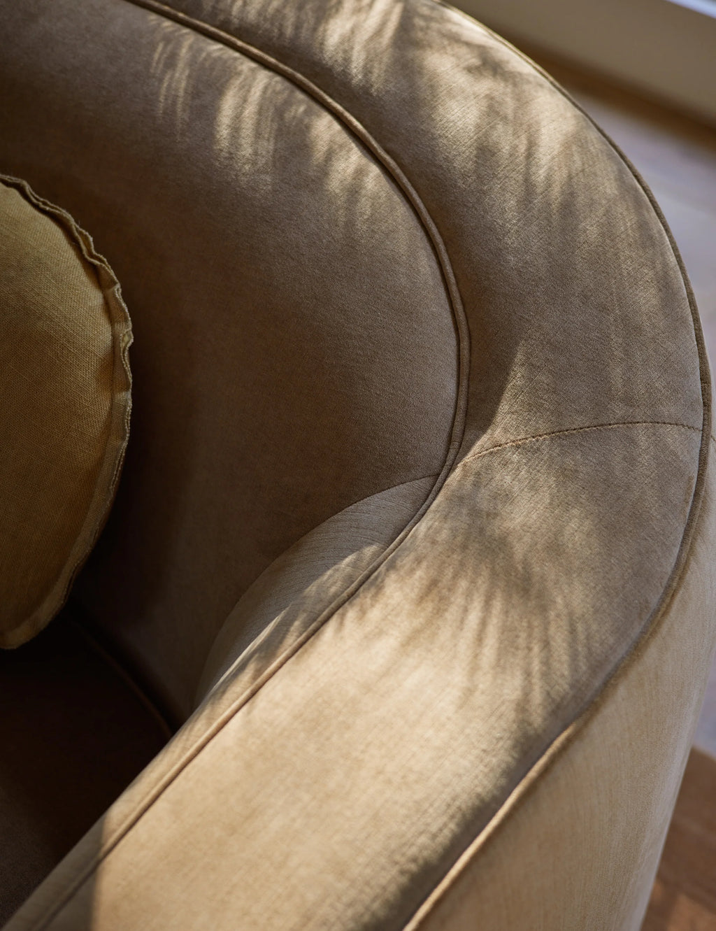 Close-up of Shigeo Sofa armrest, highlighting smooth fabric and craftsmanship