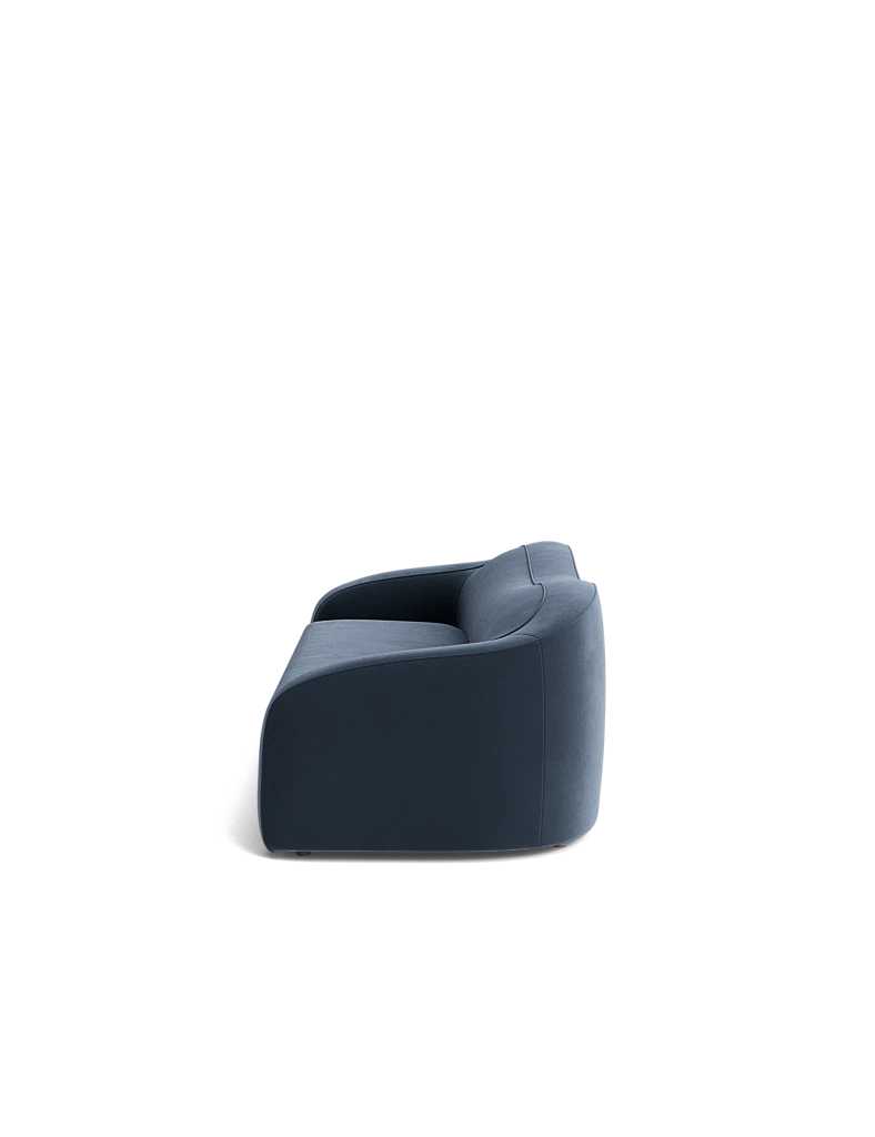 Detailed shot of the curved backrest and seam stitching on the Shigeo Sofa, custom-made elegance