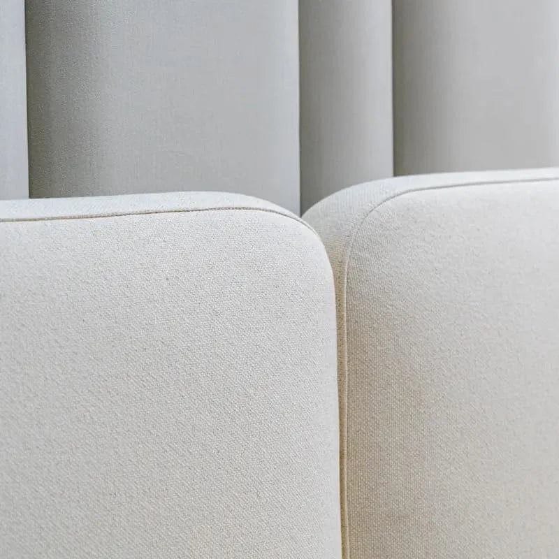 Detailed close-up of the Sugou Bed’s soft fabric finish and tailored upholstery edges
