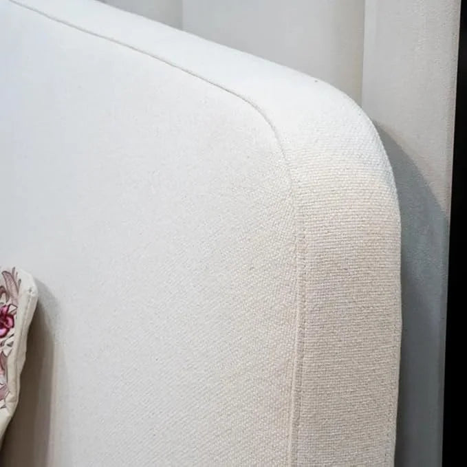 Detailed close-up of the Sugou Bed’s soft fabric finish and tailored upholstery edges