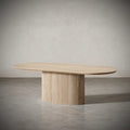 Angled view of Vangeance Oval Table highlighting its sleek oval surface and modern fluted legs