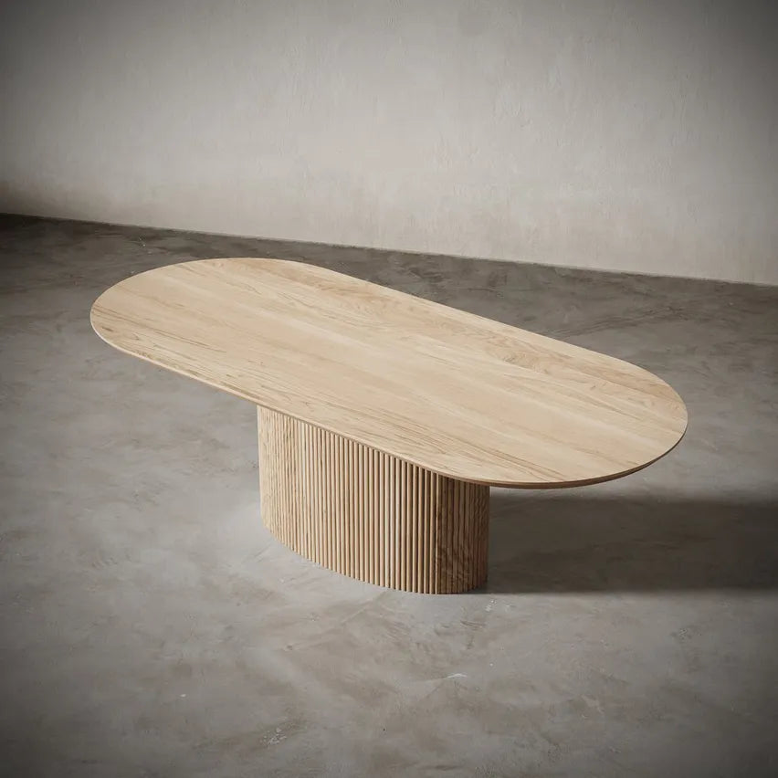 Top-down image of Vangeance Oval Dining Table revealing smooth oval form