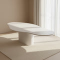 Vebis white organic-shaped dining table underside showing sturdy pedestal attachment and fiberboard core