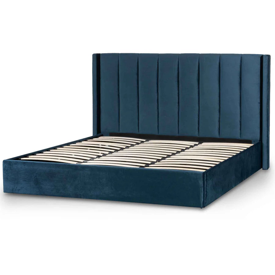 Side view of Yuuki Navy color Velvet Bed showing supportive frame, slightly raised base, and smooth velvet texture