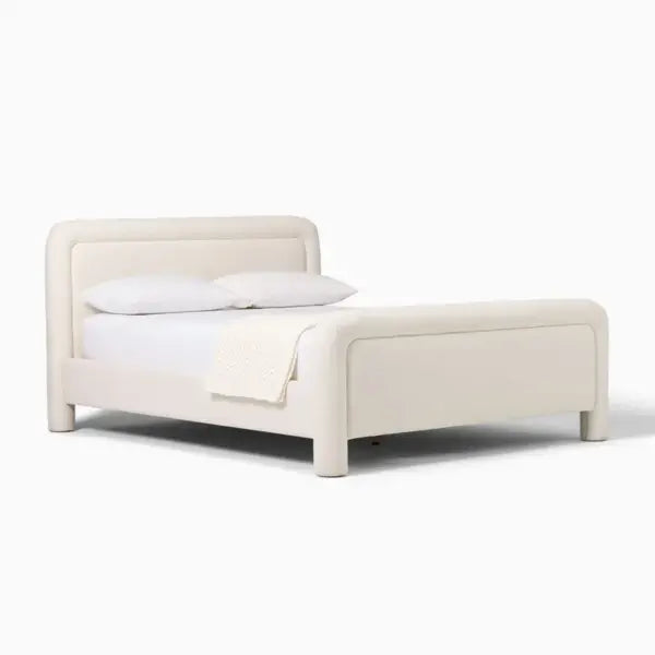 Zerin Bed Frame in plain studio setting, emphasizing minimal form and custom fabric finish