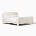 Zerin Bed Frame in plain studio setting, emphasizing minimal form and custom fabric finish