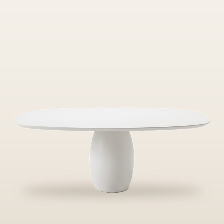 Vebis white organic-shaped dining table underside showing sturdy pedestal attachment and fiberboard core