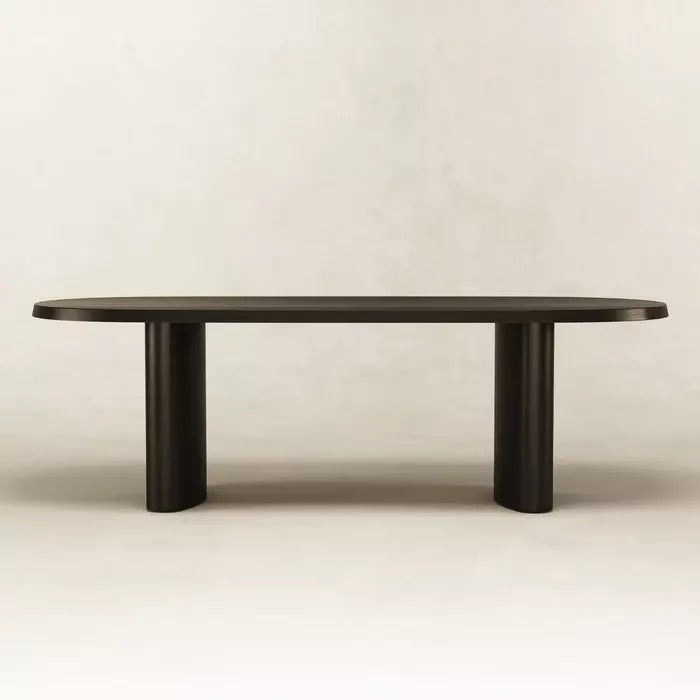 Straight-on view of black Zora Ideale Dining Table showcasing minimalist lines and solid wood construction