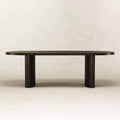 Straight-on view of black Zora Ideale Dining Table showcasing minimalist lines and solid wood construction